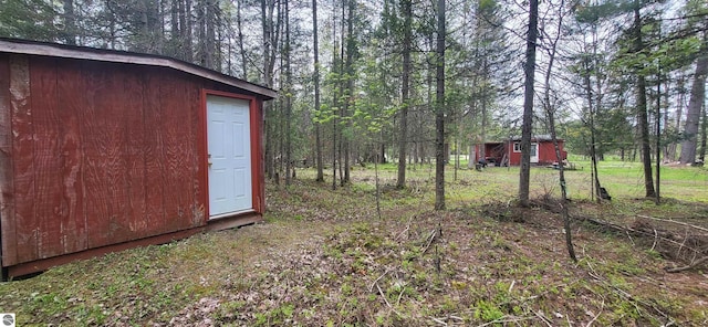 6031 Collins Rd, Onaway, MI 49765 - view of yard featuring a forest view