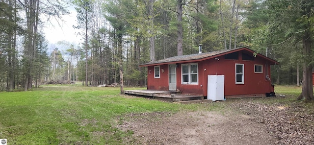 6031 Collins Rd, Onaway, MI 49765 - view of outdoor structure featuring a forest view