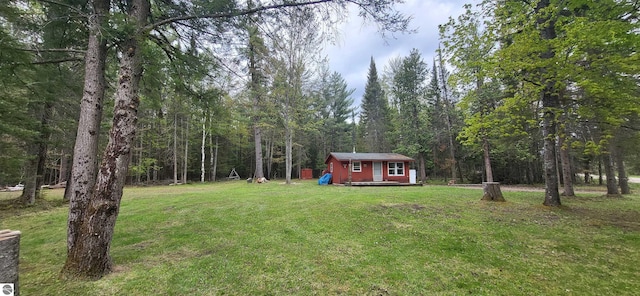 6031 Collins Rd, Onaway, MI 49765 - view of grassy yard with a view of trees