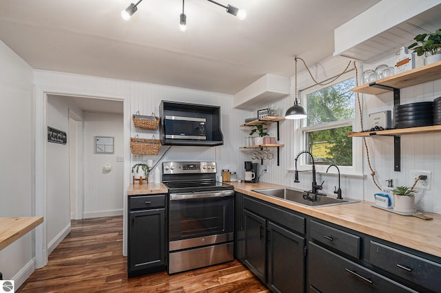 104 Haines Ave, Roscommon, MI 48653 - kitchen with open shelves, stainless steel range with electric cooktop, a sink, wooden counters, and dark wood-style flooring