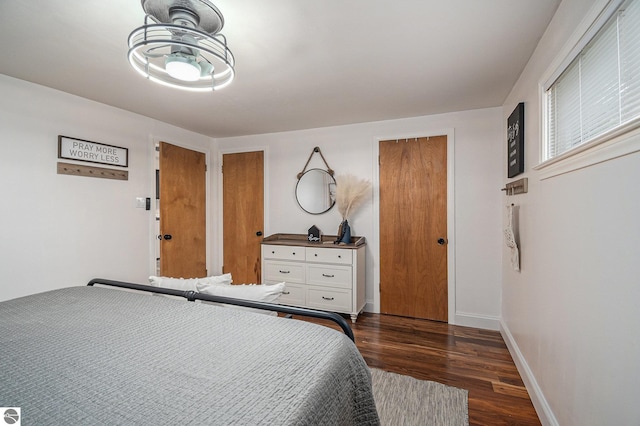 104 Haines Ave, Roscommon, MI 48653 - bedroom with dark wood-style floors and baseboards