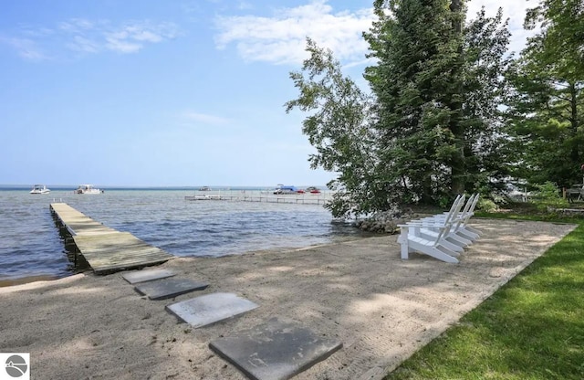104 Haines Ave, Roscommon, MI 48653 - dock area featuring a boat ramp and a water view
