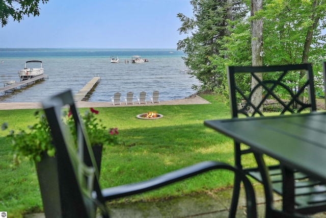 104 Haines Ave, Roscommon, MI 48653 - water view with an outdoor fire pit and a boat dock