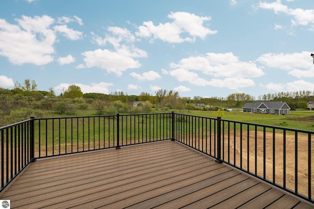 11964 E Shaker Trl, Suttons Bay, MI 49682 - wooden deck featuring a lawn