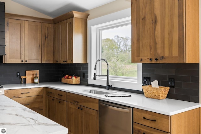 11964 E Shaker Trl, Suttons Bay, MI 49682 - kitchen featuring stainless steel dishwasher, a sink, light countertops, backsplash, and vaulted ceiling