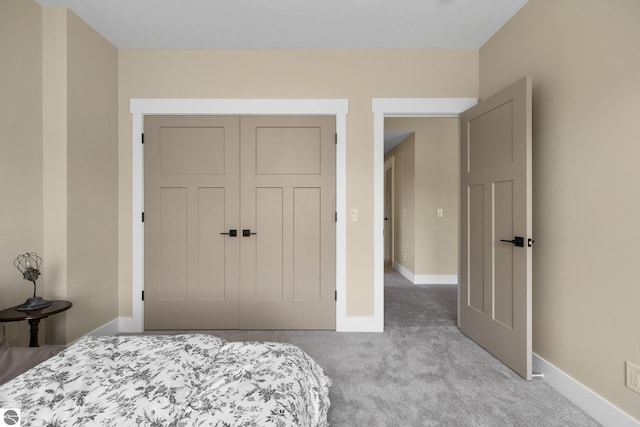 11964 E Shaker Trl, Suttons Bay, MI 49682 - bedroom with carpet floors, baseboards, and a closet