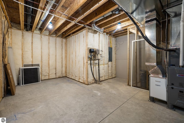 11964 E Shaker Trl, Suttons Bay, MI 49682 - unfinished basement with electric panel and heating unit
