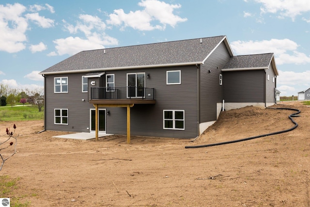 11964 E Shaker Trl, Suttons Bay, MI 49682 - back of property featuring a patio, a deck, and a shingled roof