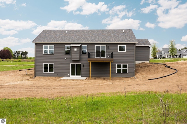 11964 E Shaker Trl, Suttons Bay, MI 49682 - rear view of property featuring a shingled roof
