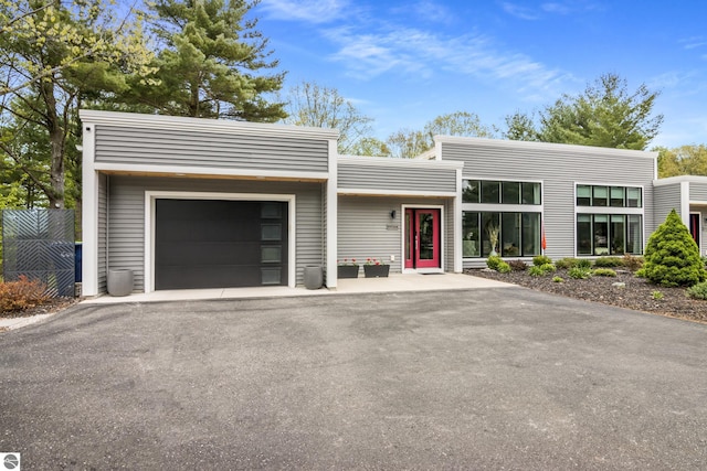 8906A Manhattan N Unit A, Traverse City, MI 49685 - contemporary house featuring asphalt driveway
