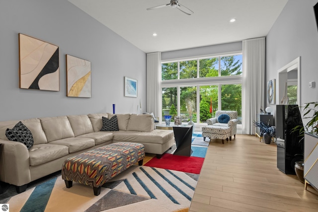 8906A Manhattan N Unit A, Traverse City, MI 49685 - living area featuring a wall of windows, ceiling fan, wood finished floors, and recessed lighting