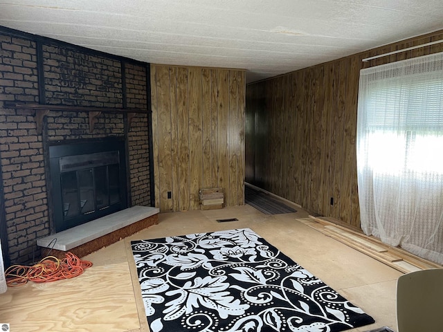 118 W Huron, Omer, MI 48749 - living room with wood walls and a fireplace