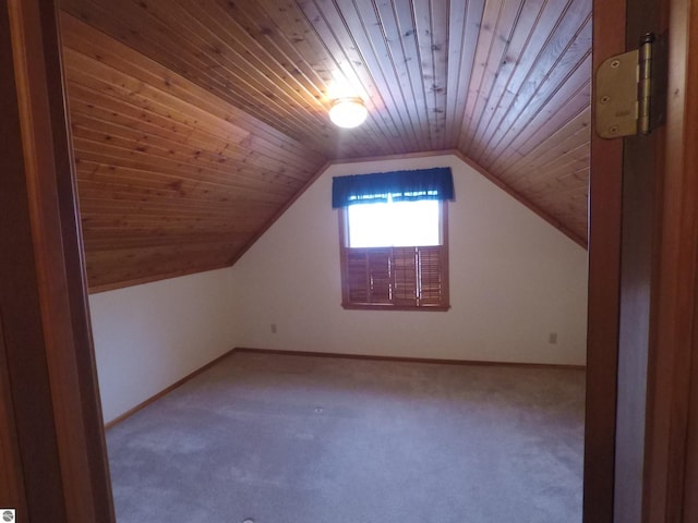 2118 E Lake Mitchell Dr, Cadillac, MI 49601 - bonus room with wood ceiling, carpet flooring, baseboards, and lofted ceiling
