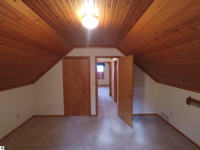 2118 E Lake Mitchell Dr, Cadillac, MI 49601 - bonus room featuring wooden ceiling, vaulted ceiling, and baseboards