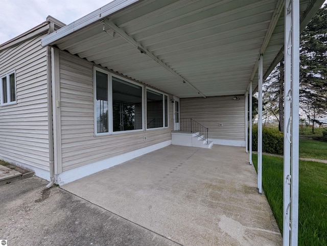 1082 S Sixth St, Au Gres, MI 48703 - view of patio with a carport