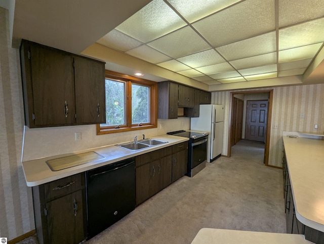 1082 S Sixth St, Au Gres, MI 48703 - kitchen featuring black dishwasher, electric stove, freestanding refrigerator, a sink, and light countertops