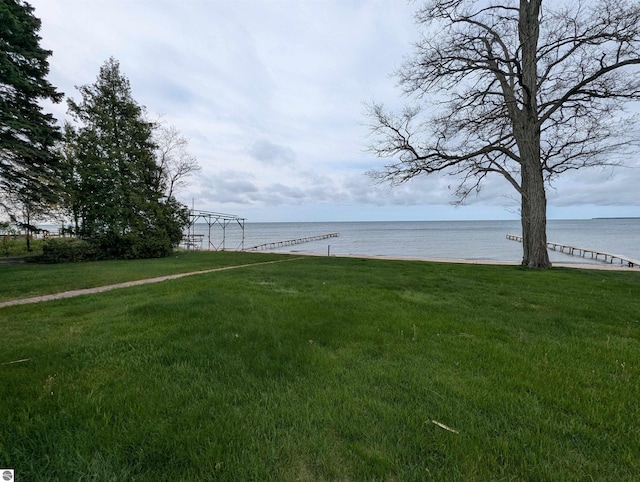 1082 S Sixth St, Au Gres, MI 48703 - view of grassy yard with a water view