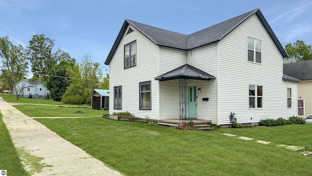 314 E River St, Cadillac, MI 49601 - view of front of property featuring a front lawn and roof with shingles
