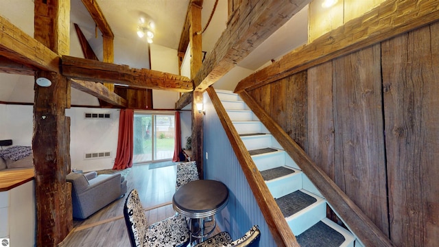 605 Cedar Ave, Houghton Lake, MI 48651 - staircase featuring wood finished floors