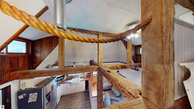 605 Cedar Ave, Houghton Lake, MI 48651 - interior space featuring a textured ceiling and wood finished floors