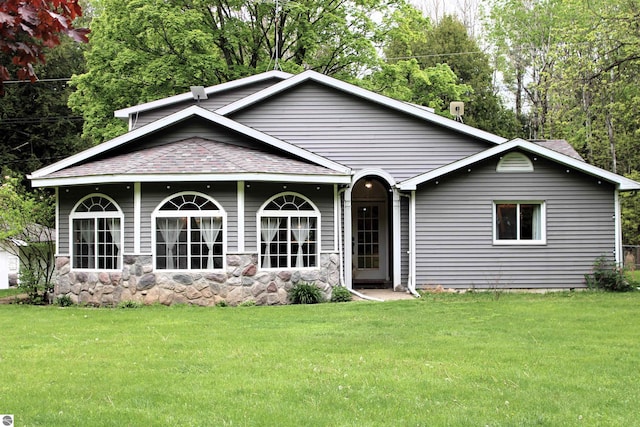 3690 Rau Rd, West Branch, MI 48661 - back of house featuring a lawn and a shingled roof