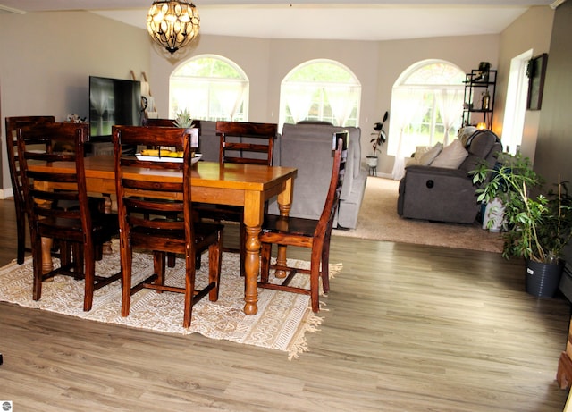 3690 Rau Rd, West Branch, MI 48661 - dining room featuring wood finished floors and a chandelier