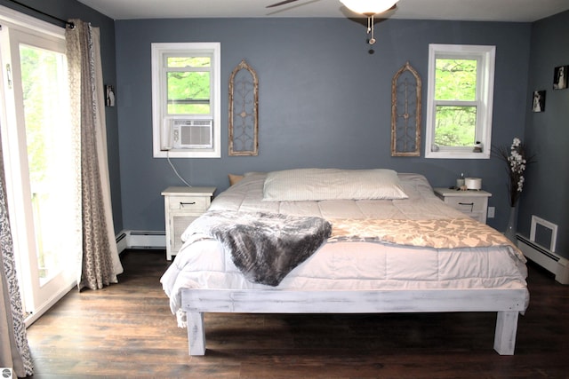 3690 Rau Rd, West Branch, MI 48661 - bedroom featuring cooling unit, multiple windows, baseboard heating, and wood finished floors