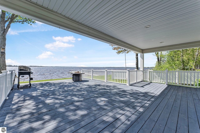 3151 W Lake Mitchell Dr, Cadillac, MI 49601 - wooden deck featuring a water view