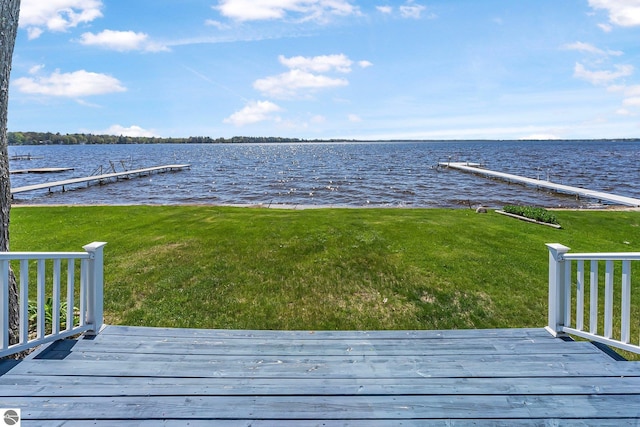 3151 W Lake Mitchell Dr, Cadillac, MI 49601 - dock featuring a water view and a lawn