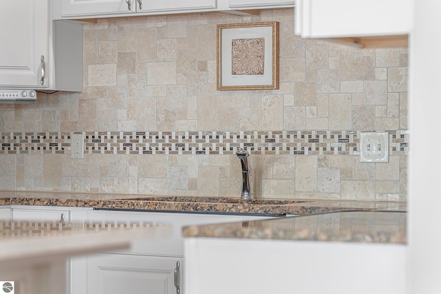 3151 W Lake Mitchell Dr, Cadillac, MI 49601 - kitchen view of tasteful backsplash and white cabinets