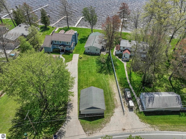 3151 W Lake Mitchell Dr, Cadillac, MI 49601 - aerial view of residential area with a nearby body of water