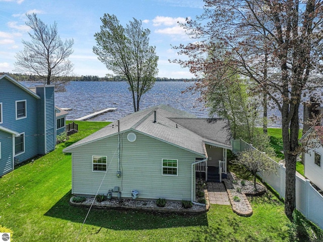 3151 W Lake Mitchell Dr, Cadillac, MI 49601 - back of property featuring a water view and roof with shingles