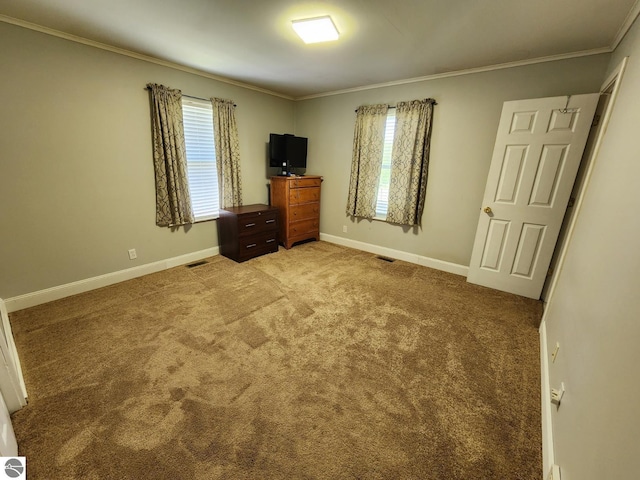 6878 Boss Rd, Ellsworth, MI 49727 - unfurnished bedroom with crown molding, light carpet, and baseboards