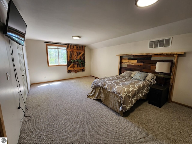 6878 Boss Rd, Ellsworth, MI 49727 - bedroom featuring carpet, baseboards, and vaulted ceiling