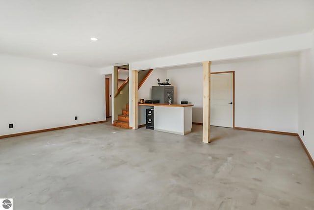 8281 M-66, Fife Lake, MI 49633 - finished below grade area featuring stairway, baseboards, and recessed lighting