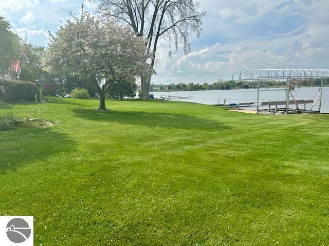 1094 Fairway Dr, Lake Isabella, MI 48893 - view of grassy yard with a water view