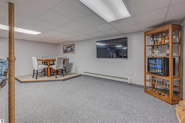 605 E M-55, West Branch, MI 48661 - rec room featuring a baseboard radiator, carpet flooring, a paneled ceiling, and baseboards
