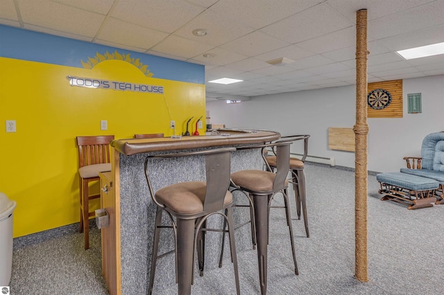605 E M-55, West Branch, MI 48661 - indoor bar featuring carpet floors, a drop ceiling, and a baseboard radiator
