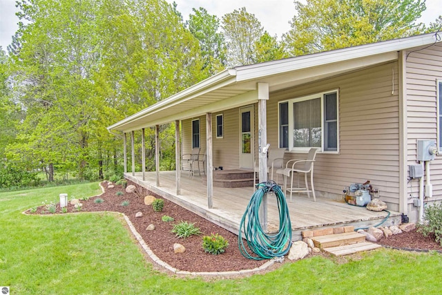 605 E M-55, West Branch, MI 48661 - exterior space with a front lawn and a deck