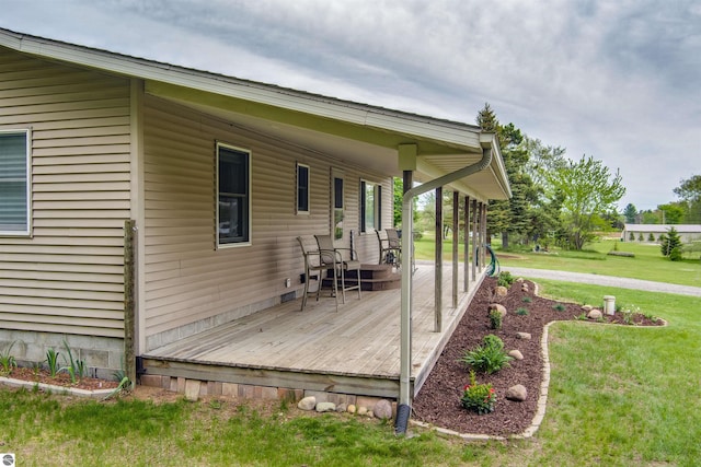 605 E M-55, West Branch, MI 48661 - deck featuring a yard