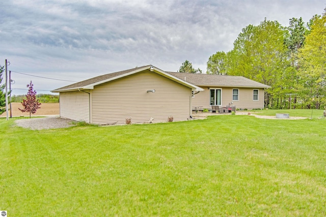 605 E M-55, West Branch, MI 48661 - back of house featuring a lawn