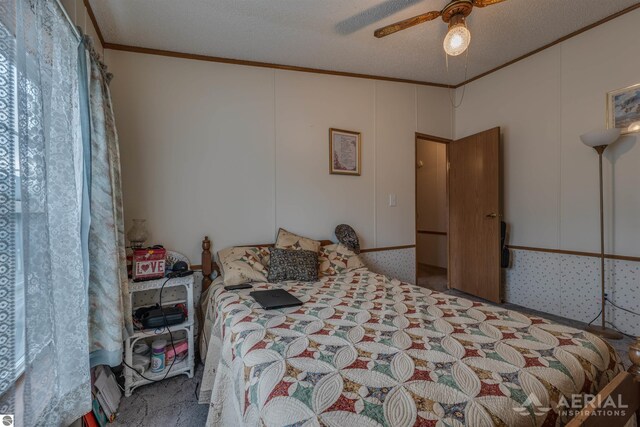 1929 Mohawk Trl, West Branch, MI 48661 - carpeted bedroom featuring crown molding and a ceiling fan