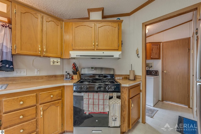 1929 Mohawk Trl, West Branch, MI 48661 - kitchen featuring range with gas cooktop, washer / clothes dryer, under cabinet range hood, light flooring, and light countertops
