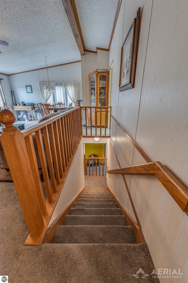 1929 Mohawk Trl, West Branch, MI 48661 - stairway with carpet flooring, a textured ceiling, and ornamental molding