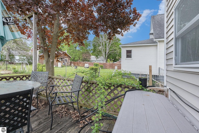 832 Wallace St, Cadillac, MI 49601 - deck featuring outdoor dining area