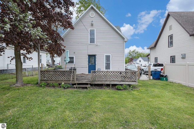 832 Wallace St, Cadillac, MI 49601 - back of house with a wooden deck