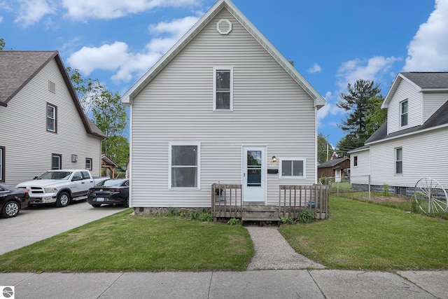 832 Wallace St, Cadillac, MI 49601 - view of front of house with a wooden deck