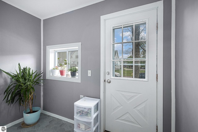 832 Wallace St, Cadillac, MI 49601 - doorway featuring healthy amount of natural light, baseboards, and ornamental molding