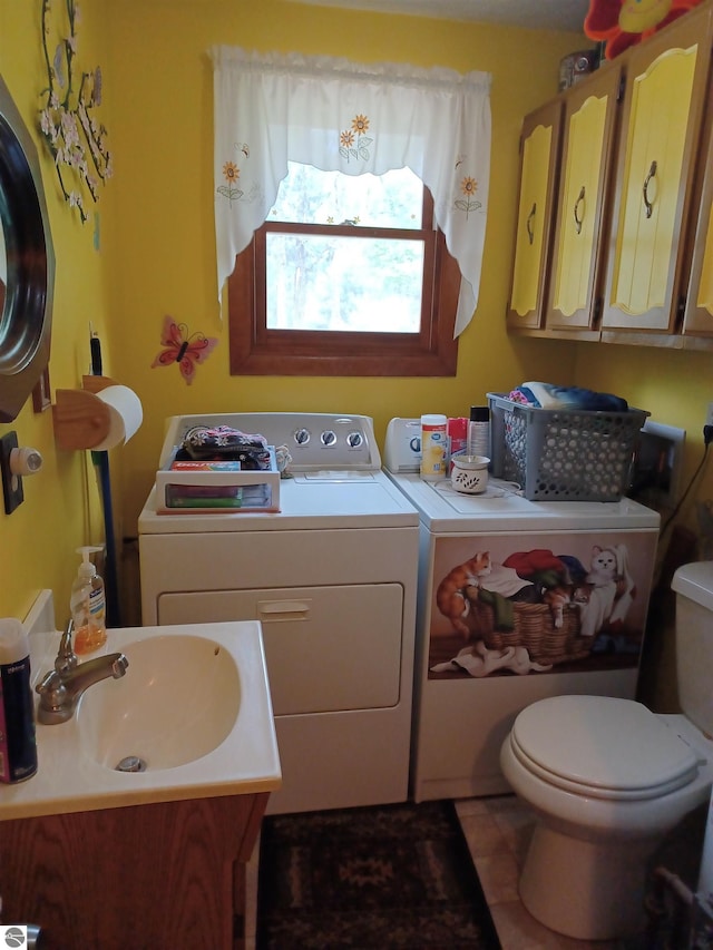 4440 M-65, Oscoda, MI 48750 - bathroom featuring washer and dryer, toilet, and vanity
