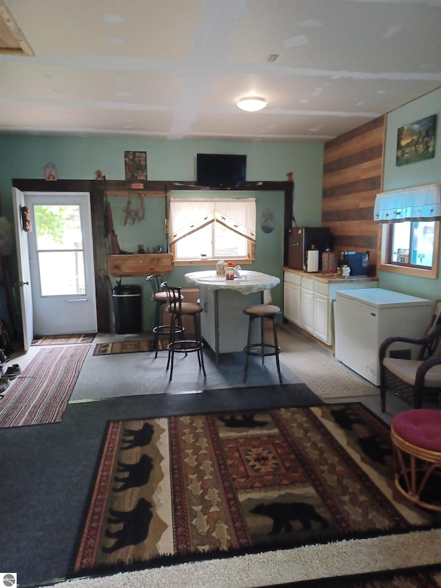 4440 M-65, Oscoda, MI 48750 - kitchen with wood walls and white cabinetry